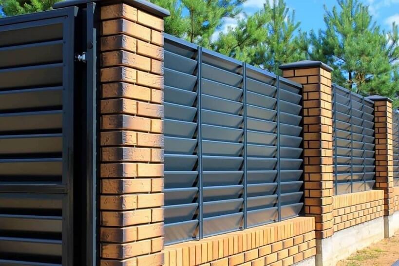 Liquid rubber coating on a wooden fence